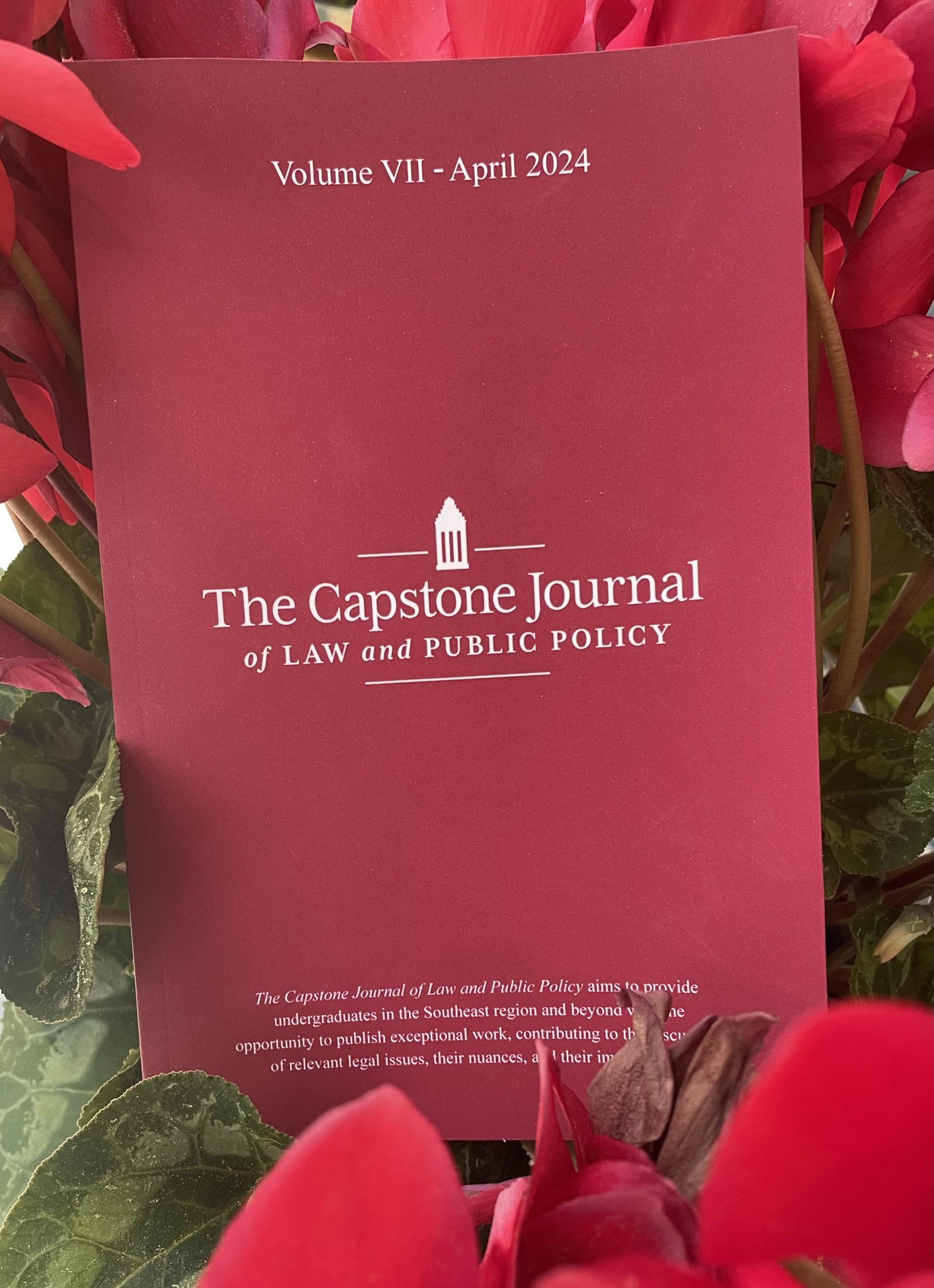 printed copy of CJLPP Volume 7 within flowers